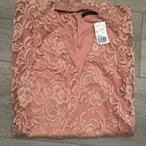 NWT mauve color lace dress. It has a v-shape front